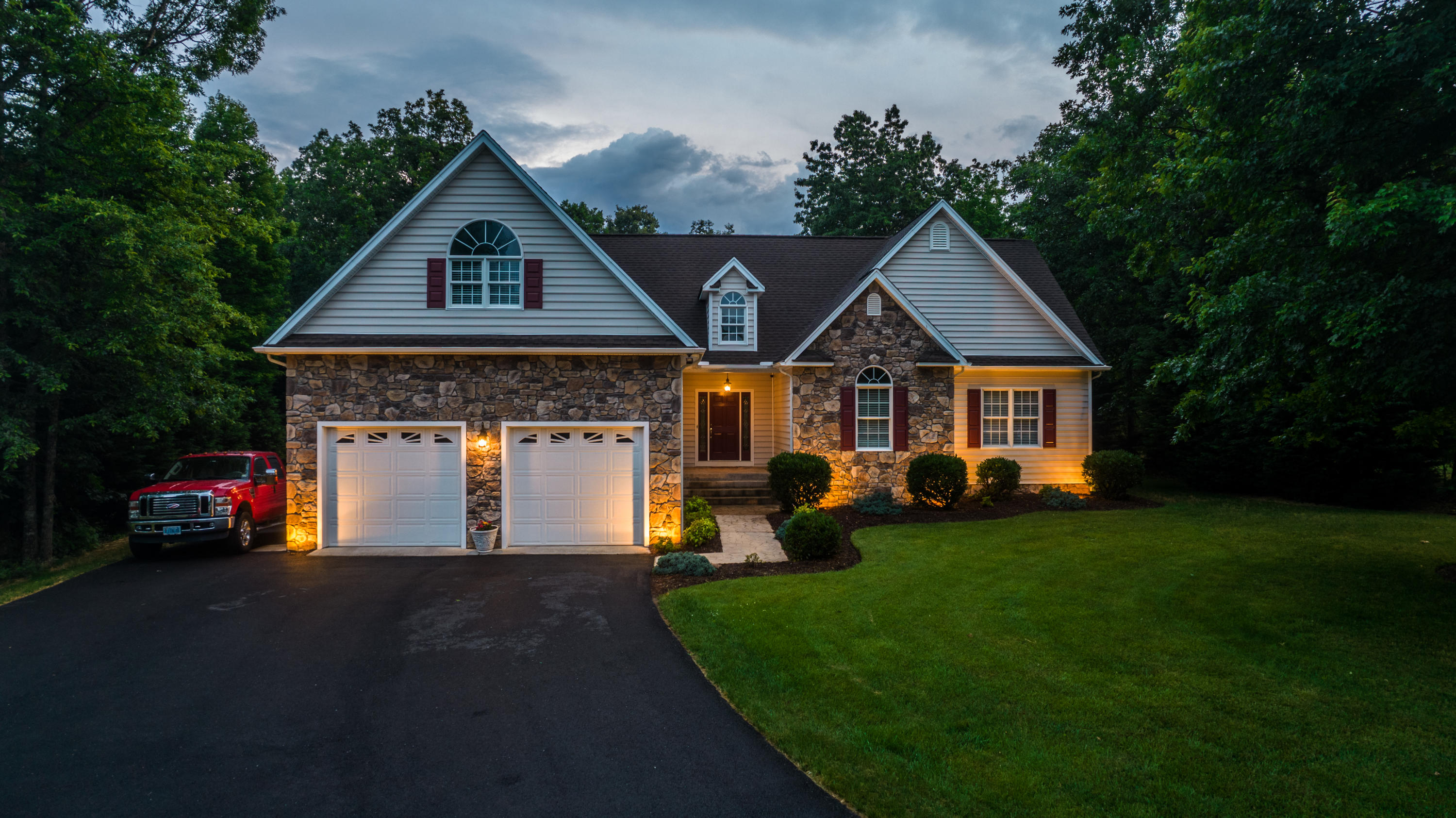 74 Chesney Place Blue Ridge, VA 24064 - Photo 1 of 71 a front view of a house with a garden and pathway