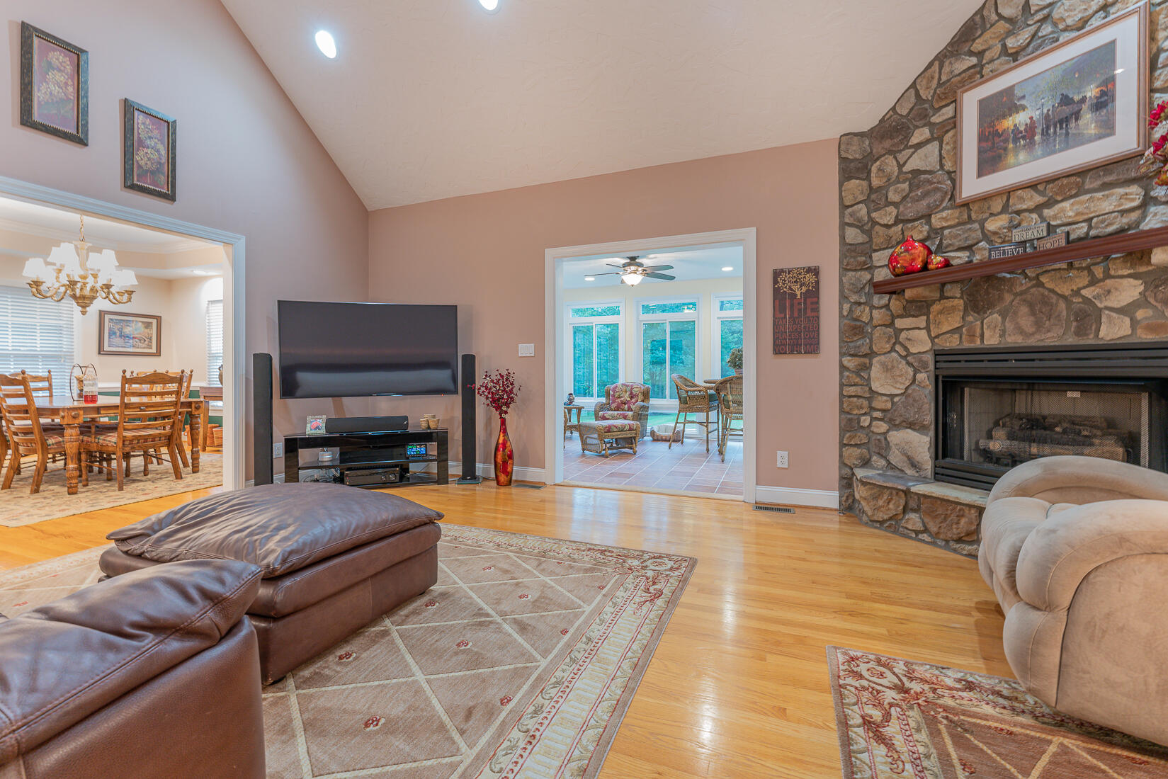 74 Chesney Place Blue Ridge, VA 24064 - Photo 12 of 71 a living room with furniture a fireplace and a flat screen tv