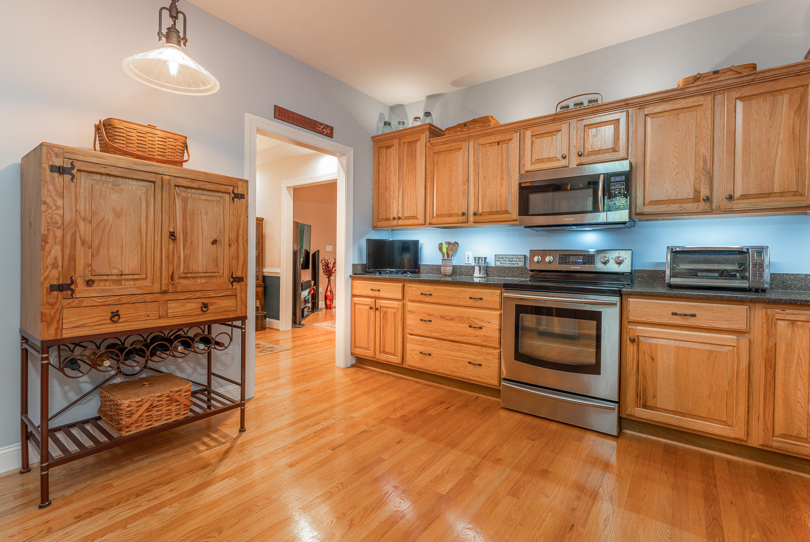 74 Chesney Place Blue Ridge, VA 24064 - Photo 28 of 71 a kitchen with stainless steel appliances granite countertop a stove top oven a sink dishwasher and cabinets with wooden floor