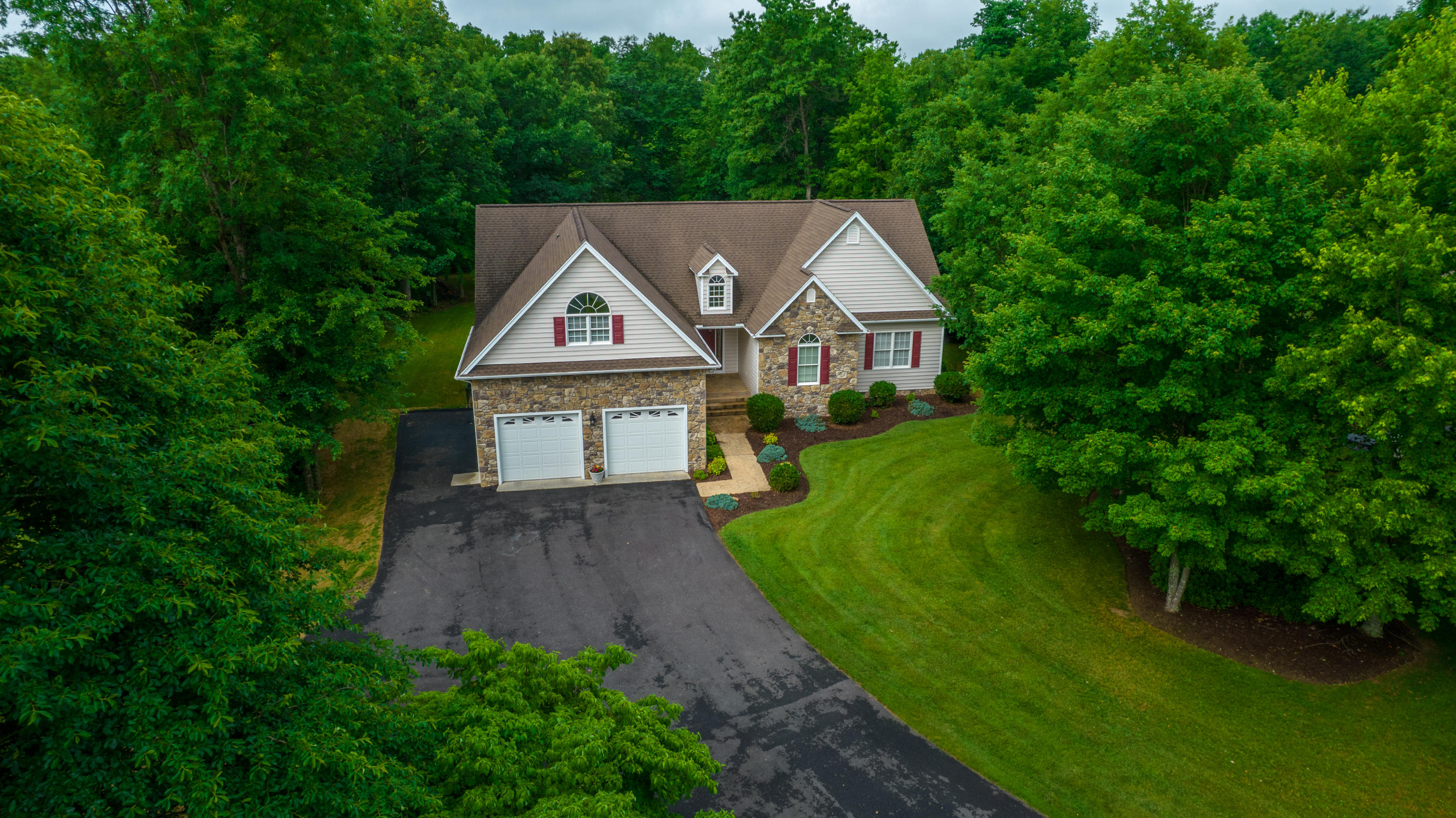 74 Chesney Place Blue Ridge, VA 24064 - Photo 4 of 71 a aerial view of a house with a big yard plants and large trees