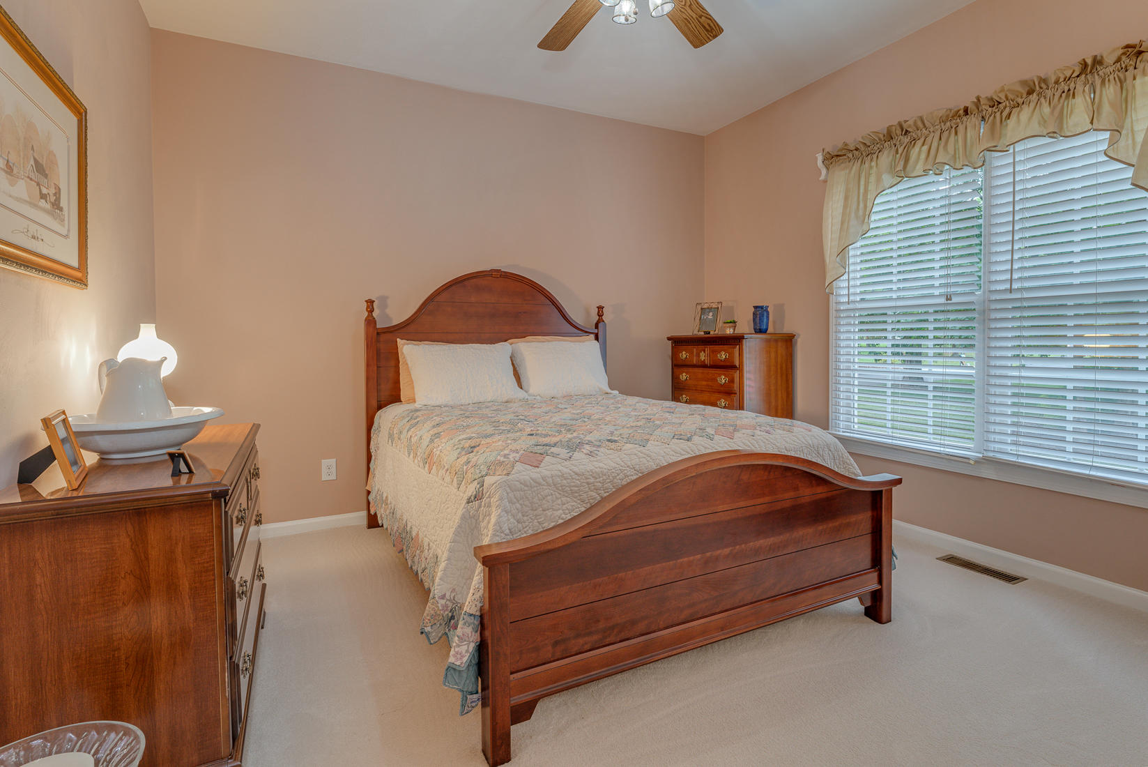 74 Chesney Place Blue Ridge, VA 24064 - Photo 40 of 71 a bed sitting in a bedroom next to a window