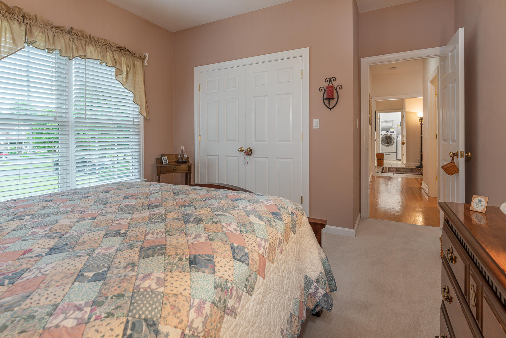74 Chesney Place Blue Ridge, VA 24064 - Photo 41 of 71 a bedroom with a bed and a chandelier
