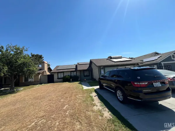 a car parked in front of a house