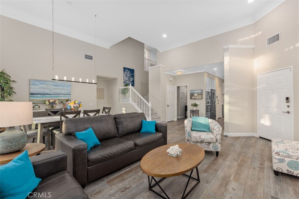 6819 Adolphia Drive Carlsbad, CA 92011 - Photo 18 of 40 a living room with furniture and wooden floor