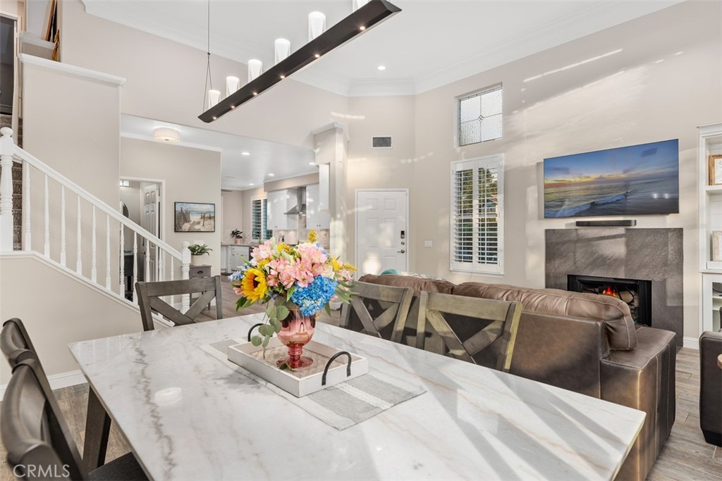 6819 Adolphia Drive Carlsbad, CA 92011 - Photo 20 of 40 a view of a dining room with furniture window and wooden floor
