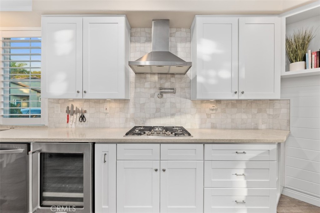6819 Adolphia Drive Carlsbad, CA 92011 - Photo 22 of 40 a kitchen with a stove and cabinets