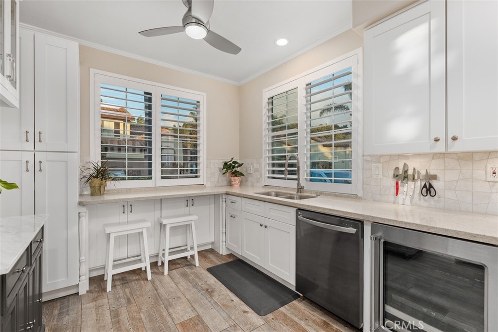 6819 Adolphia Drive Carlsbad, CA 92011 - Photo 23 of 40 a kitchen that has a sink and a stove in it