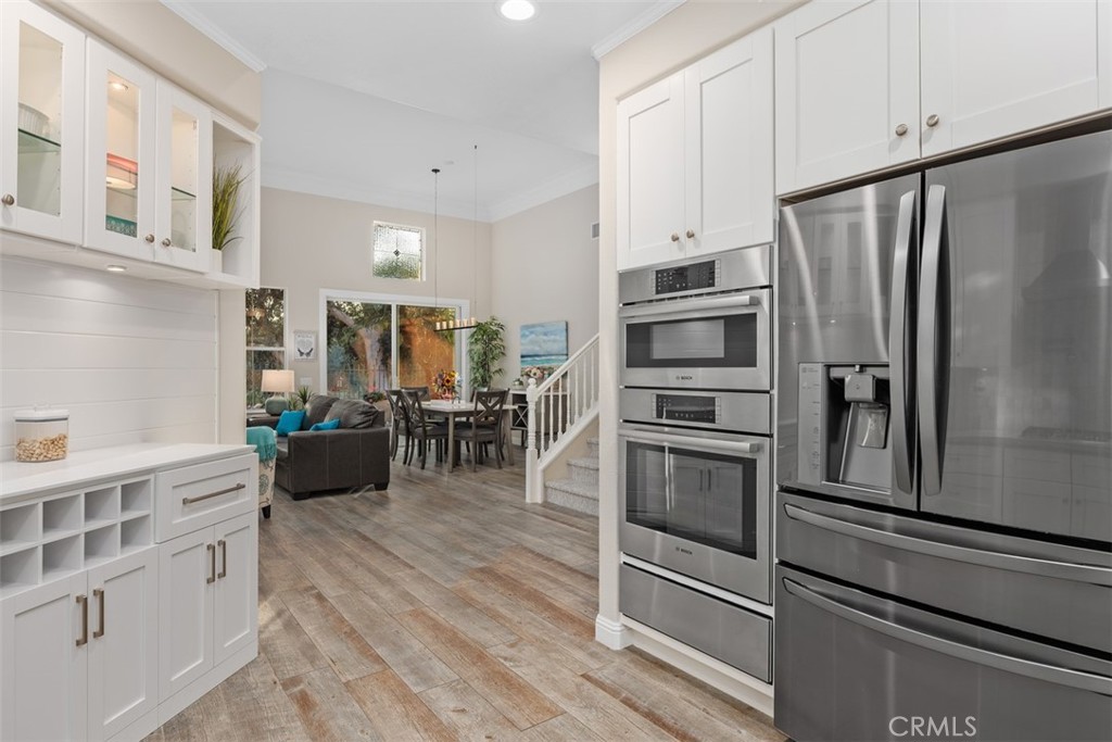 6819 Adolphia Drive Carlsbad, CA 92011 - Photo 25 of 40 a kitchen with stainless steel appliances a refrigerator and cabinets