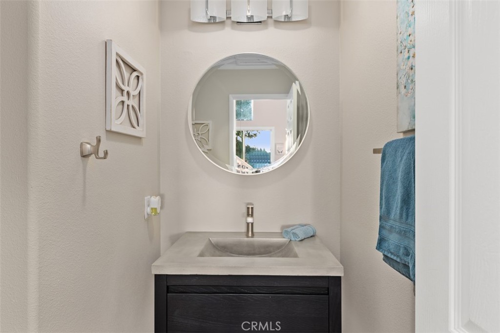 6819 Adolphia Drive Carlsbad, CA 92011 - Photo 26 of 40 a bathroom with a sink and a mirror