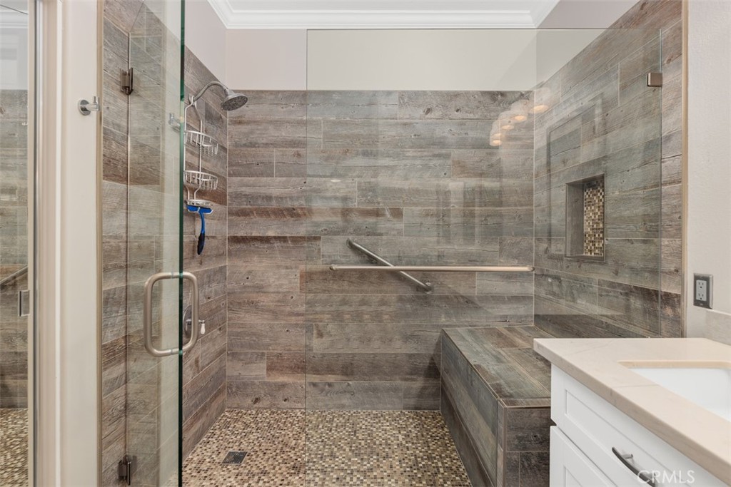 6819 Adolphia Drive Carlsbad, CA 92011 - Photo 30 of 40 a bathroom with a shower and vanity