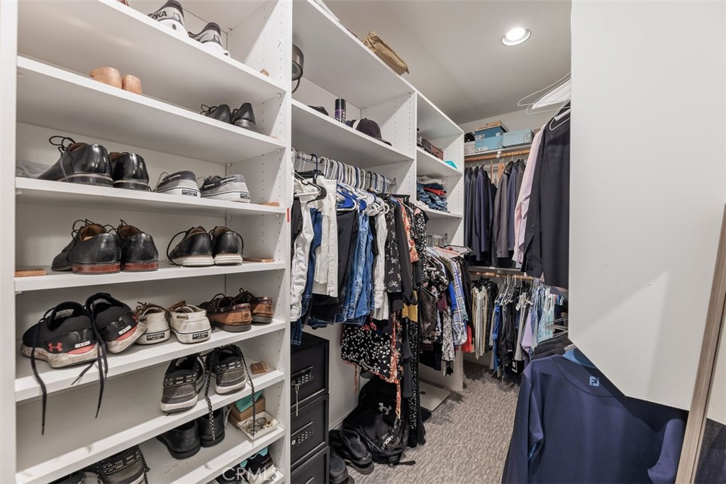 6819 Adolphia Drive Carlsbad, CA 92011 - Photo 31 of 40 a view of walk in closet with clothes and shoes