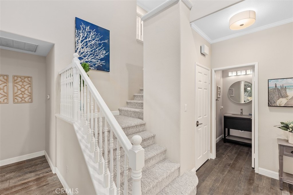 6819 Adolphia Drive Carlsbad, CA 92011 - Photo 32 of 40 a view of a hallway with bathroom and wooden floor