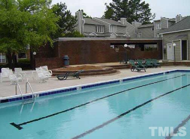 7040 Sandy Forks Road, Unit 207 Raleigh, NC 27615 - Photo 22 of 24 a view of swimming pool with outdoor seating