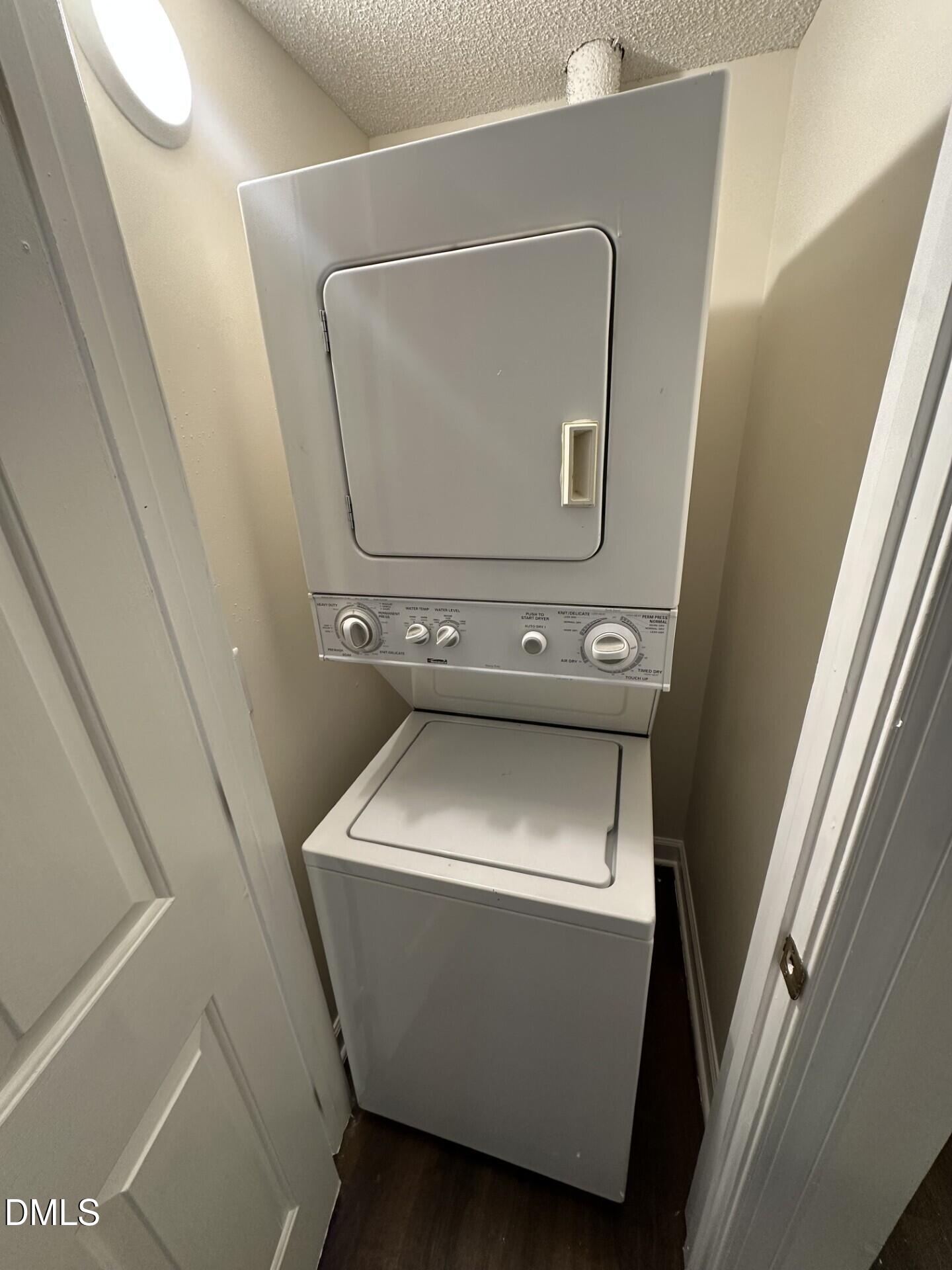 3515 Ivy Commons Drive, Unit 301 Raleigh, NC 27606 - Photo 4 of 6 a utility room with dryer and washer