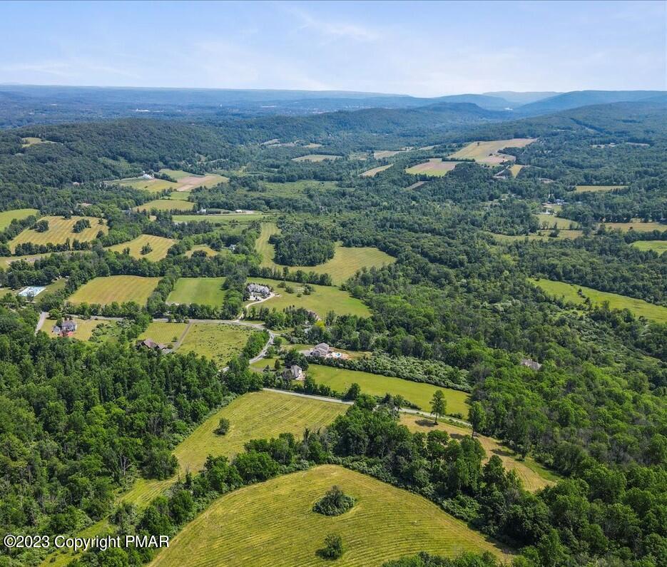 an aerial view of a residential houses and outdoor space
