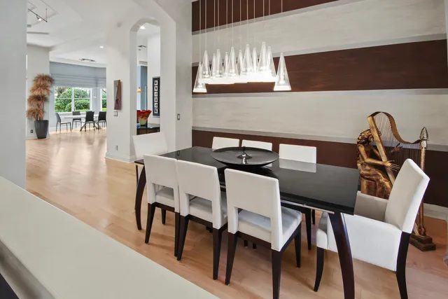 a spacious bathroom with a double vanity sink a mirror and a bathtub