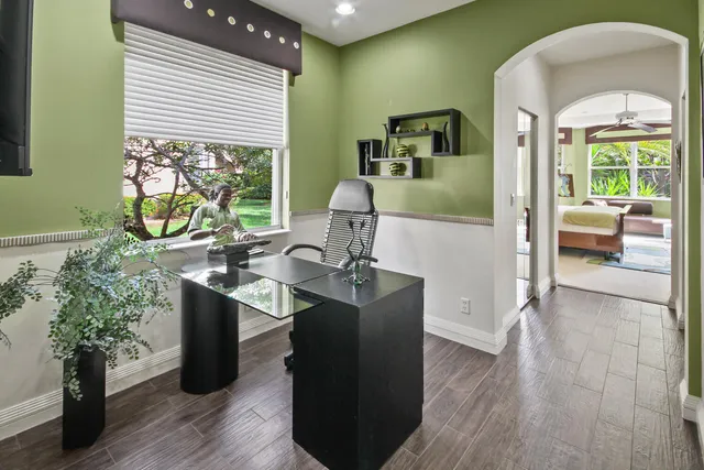 a view of a backyard with plants and patio
