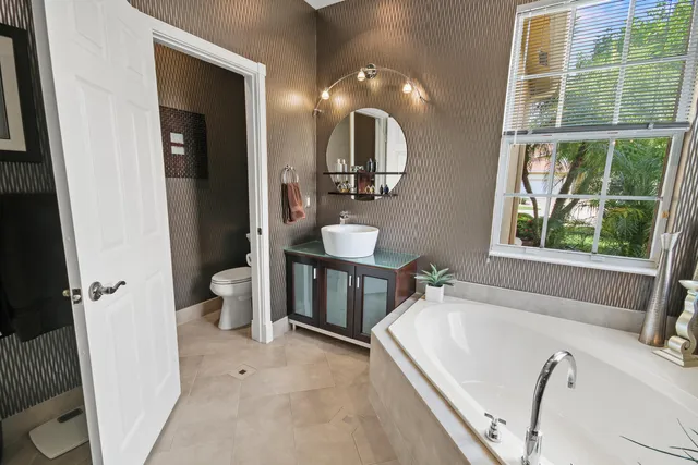 a view of a swimming pool with a table and chairs