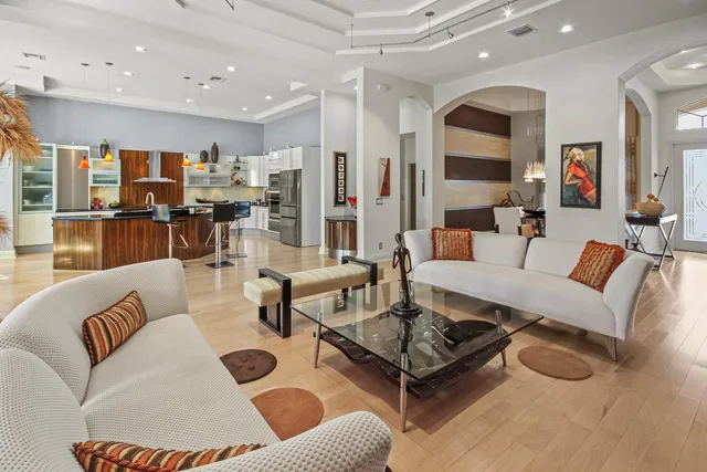 a kitchen with stainless steel appliances a stove refrigerator sink and cabinets