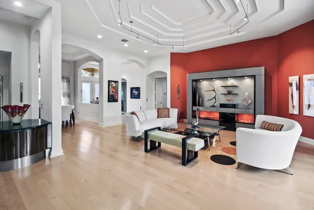 a view of a dining room with furniture and a window