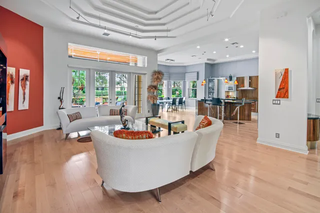 a spacious bedroom with a bed and dresser