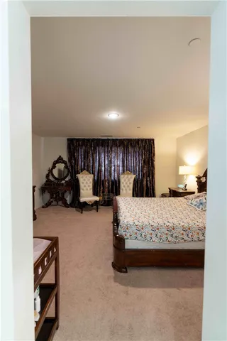 a bedroom with a bed and window