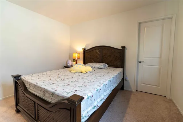 a bedroom with a bed and a cabinets