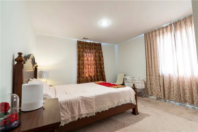 a bathroom with a granite countertop sink a shower and a mirror