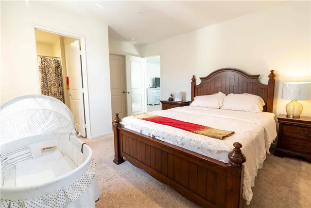 a bedroom with a bed and a dresser