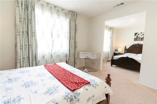 a bedroom with a bed and a view of bathroom