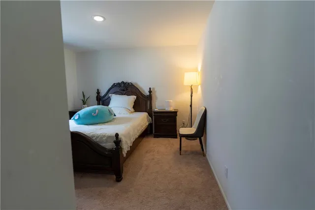 a bed room with a bed and a window