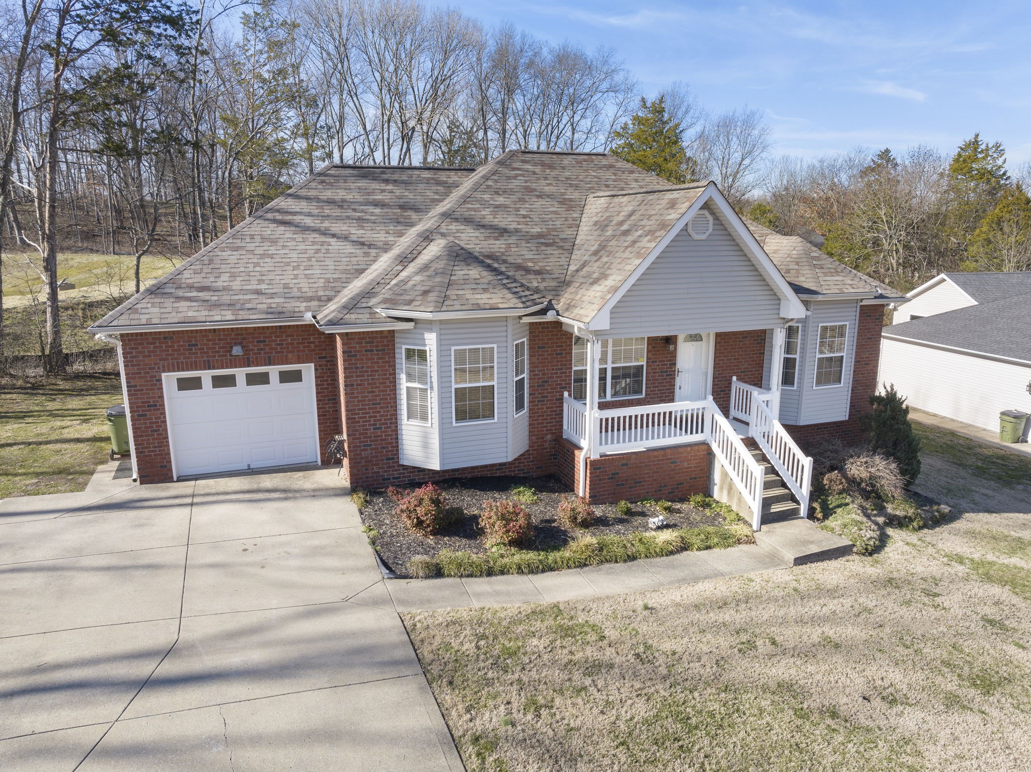 4244 Birmingham Road Lebanon, TN 37090 - Photo 1 of 40 a front view of a house with a yard and garage