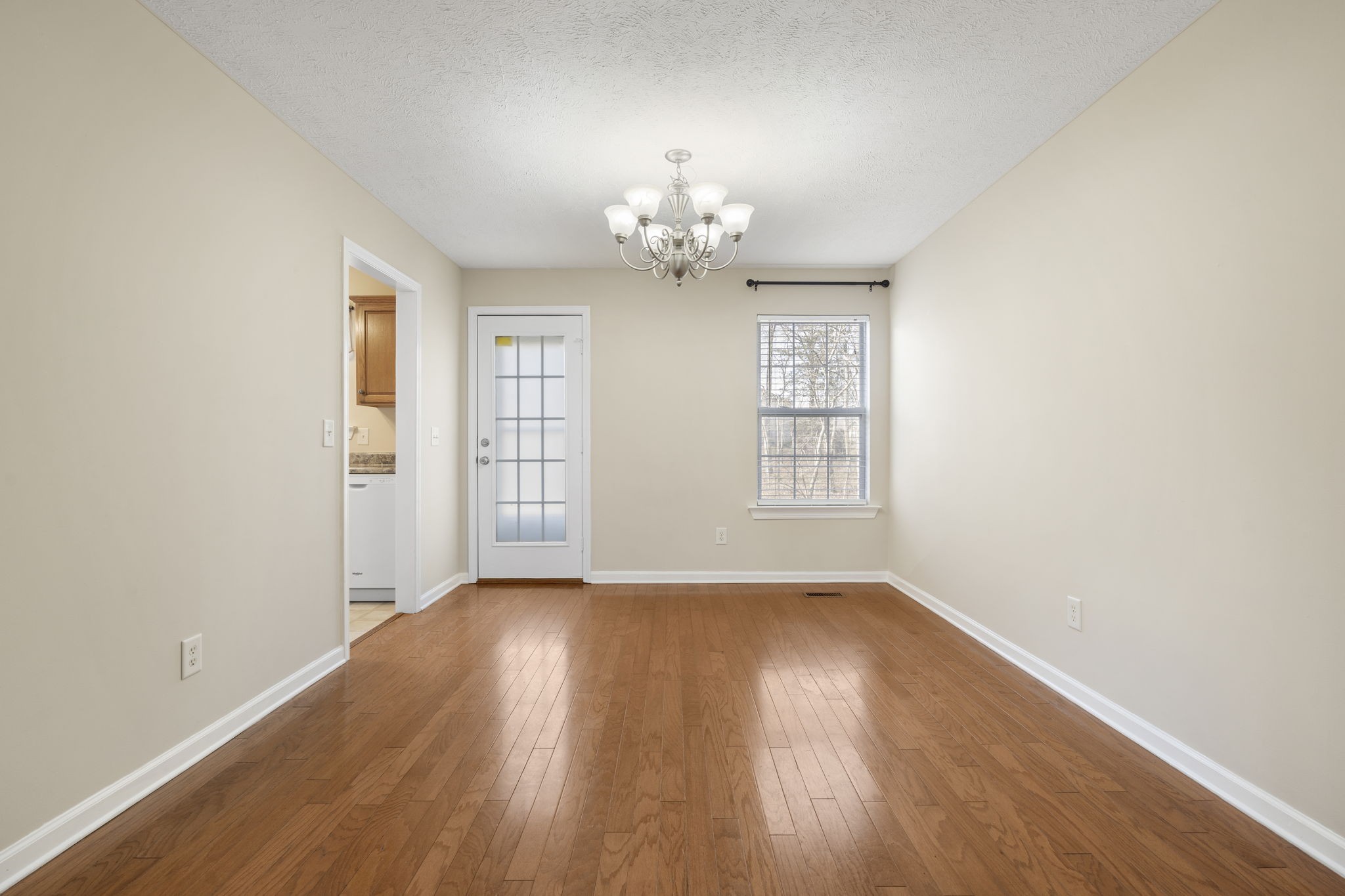 4244 Birmingham Road Lebanon, TN 37090 - Photo 13 of 40 a view of an empty room with wooden floor and a window