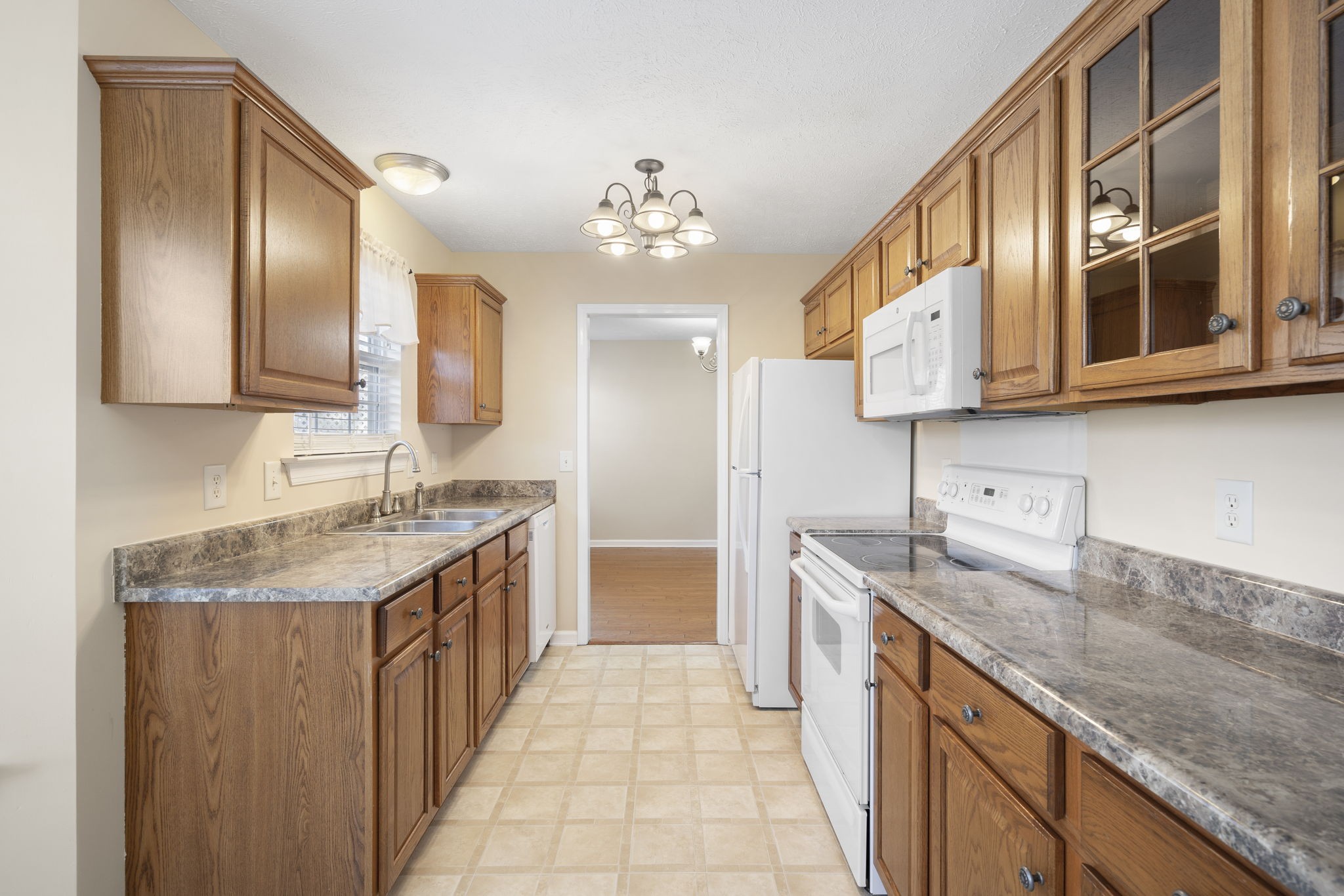 4244 Birmingham Road Lebanon, TN 37090 - Photo 18 of 40 a kitchen with stainless steel appliances granite countertop a sink and dishwasher refrigerator stove