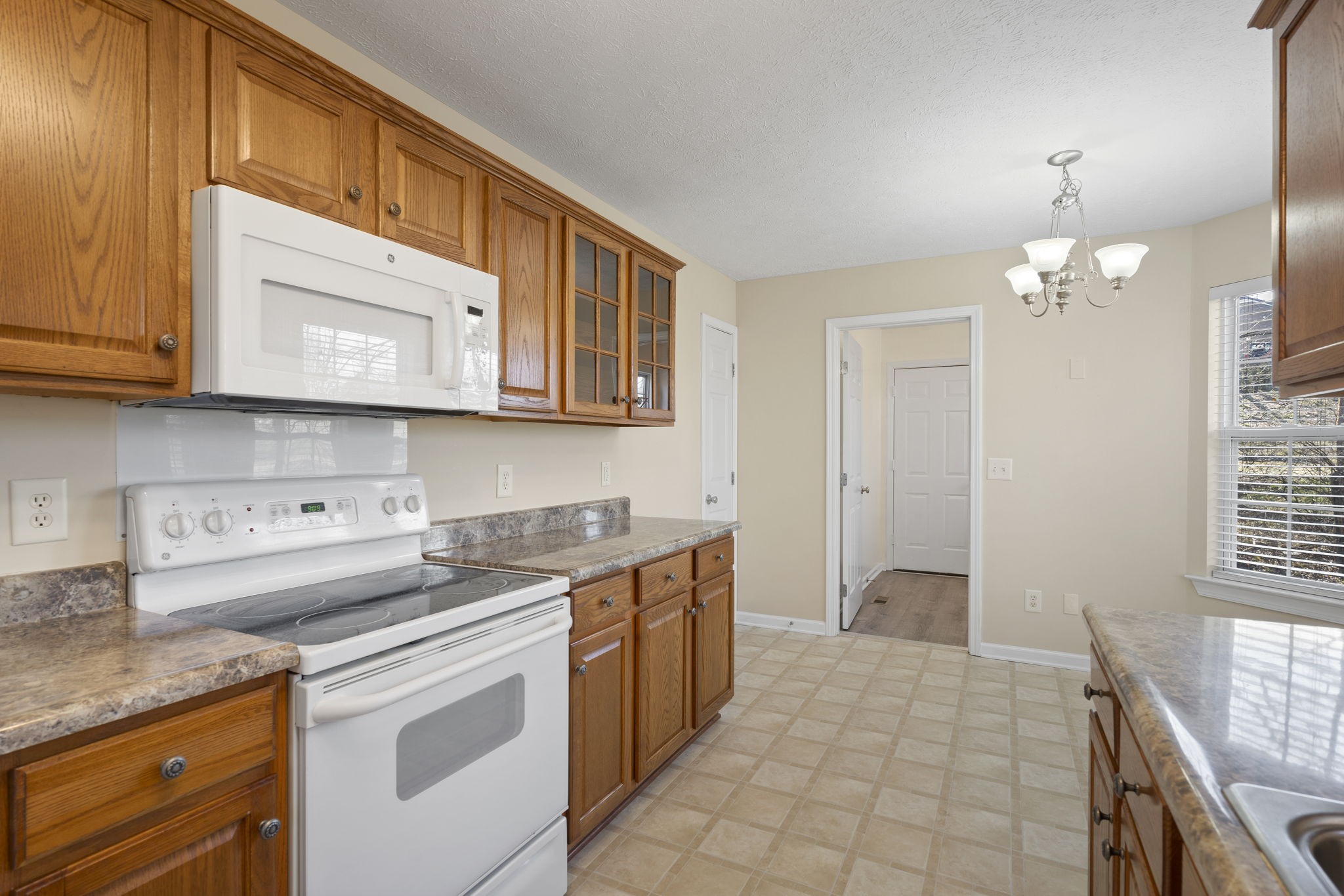 4244 Birmingham Road Lebanon, TN 37090 - Photo 20 of 40 a kitchen with stainless steel appliances granite countertop a sink and cabinets