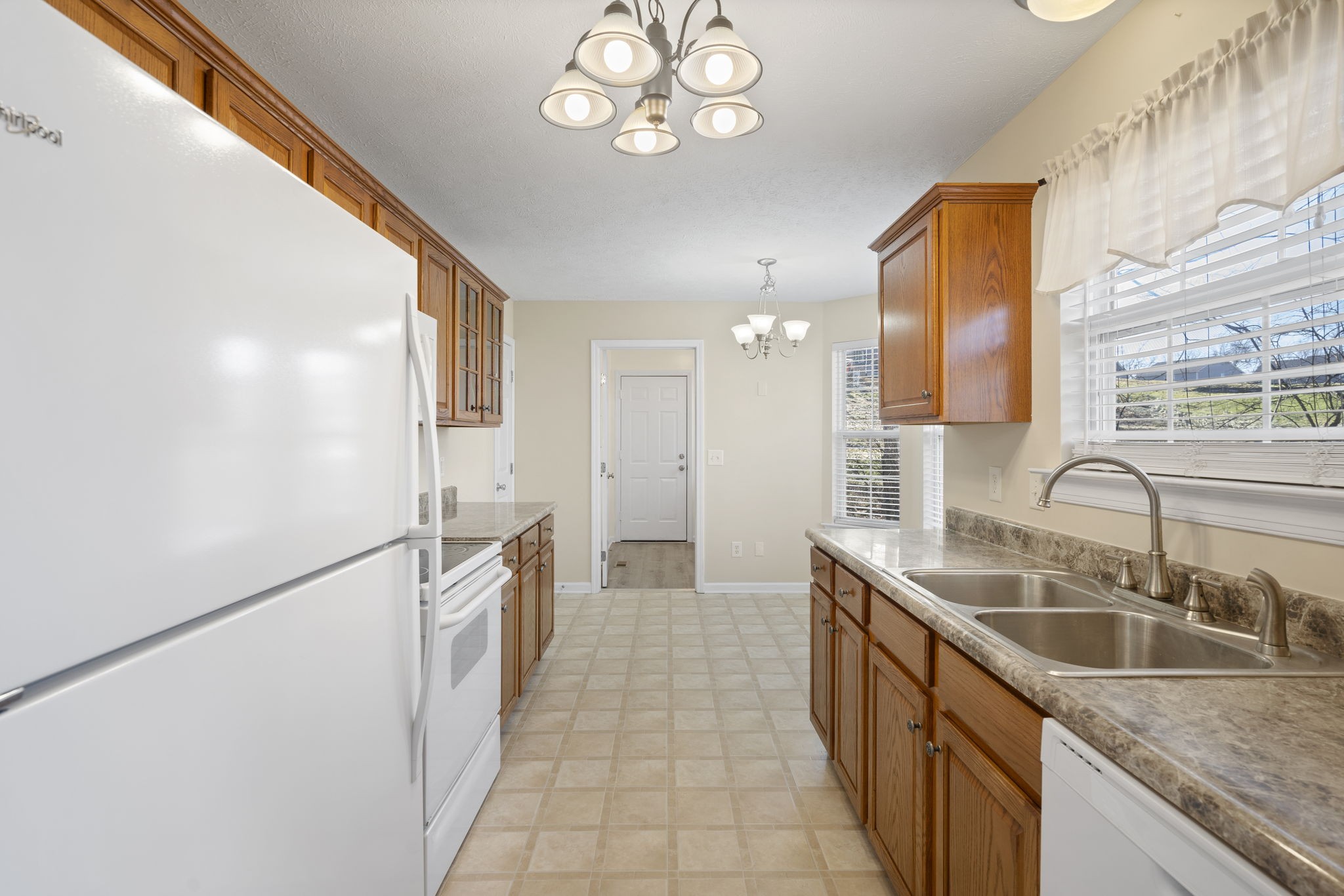 4244 Birmingham Road Lebanon, TN 37090 - Photo 21 of 40 a kitchen with a sink refrigerator and microwave