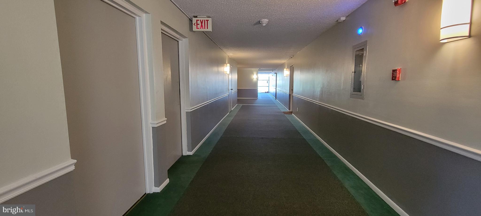 46 Township Line Road, Unit 305 Elkins Park, PA 19027 - Photo 22 of 31 a view of a hallway with wooden floor