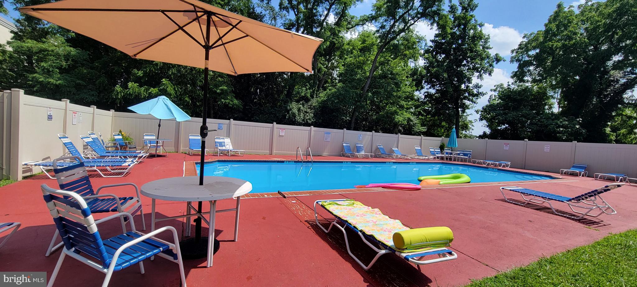 46 Township Line Road, Unit 305 Elkins Park, PA 19027 - Photo 28 of 31 a view of a backyard with furniture and a tub