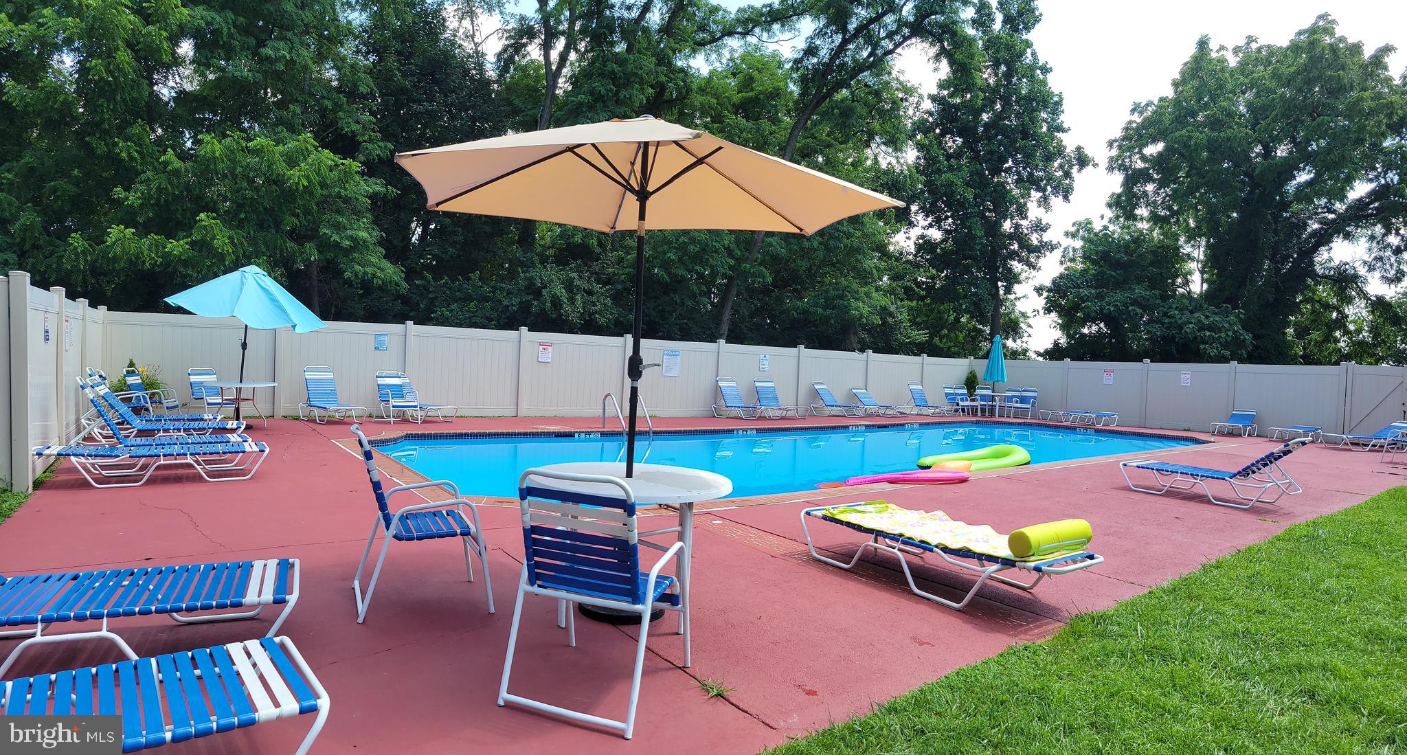 46 Township Line Road, Unit 305 Elkins Park, PA 19027 - Photo 29 of 31 a view of an outdoor space pool patio and outdoor seating