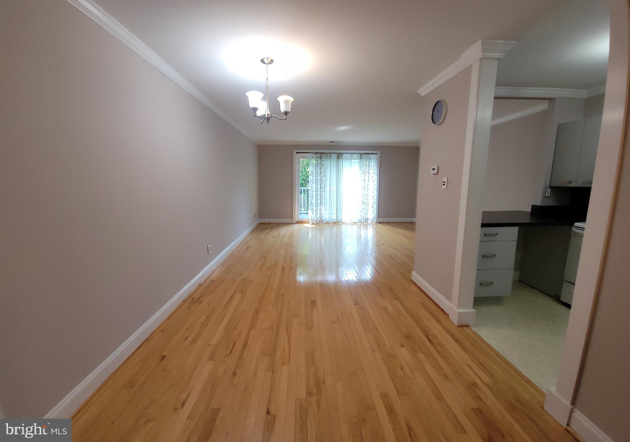 46 Township Line Road, Unit 305 Elkins Park, PA 19027 - Photo 6 of 31 wooden floor in an empty room with a window