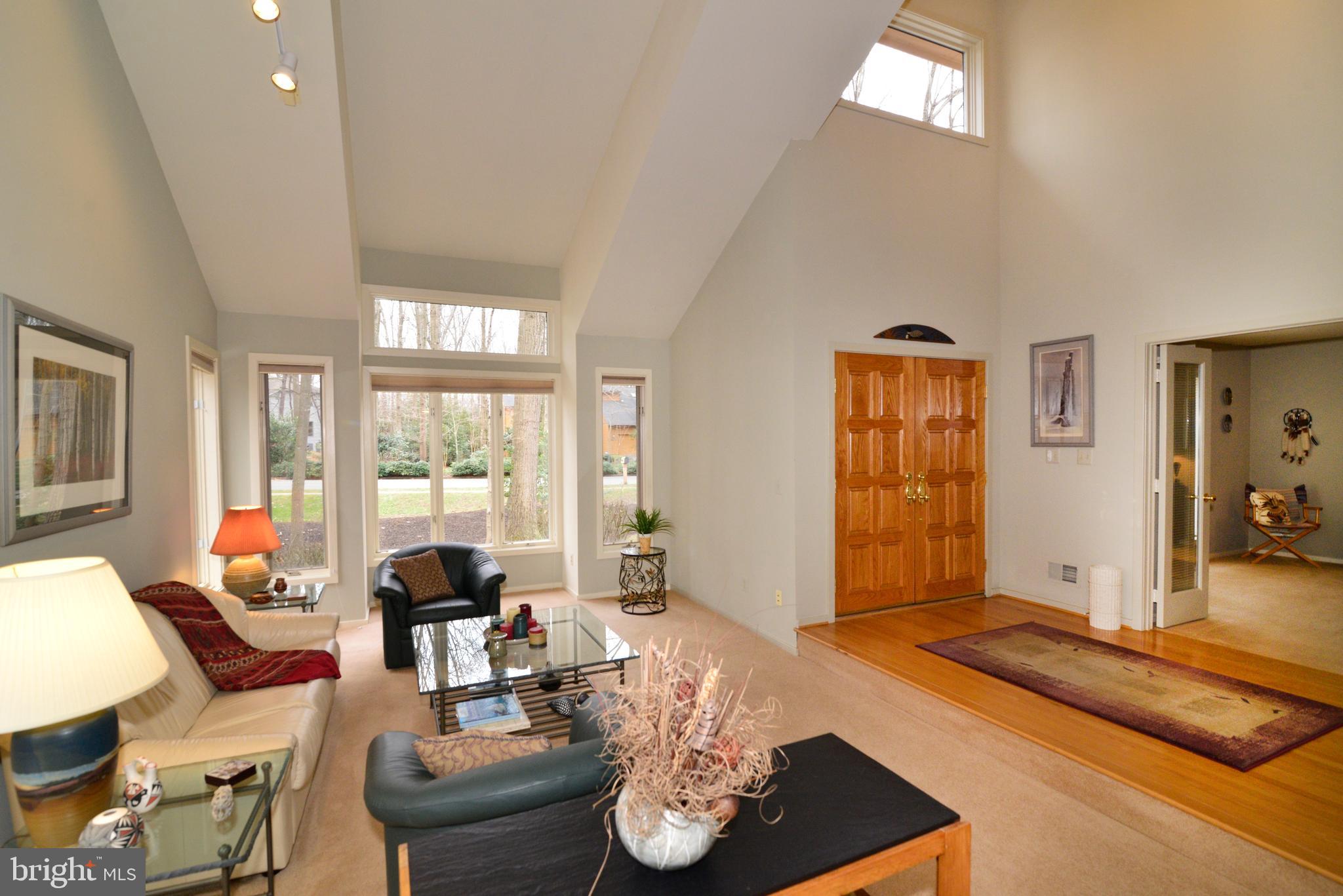 11410 Fieldstone Lane Reston, VA 20191 - Photo 7 of 50 a living room with fireplace furniture and a large window