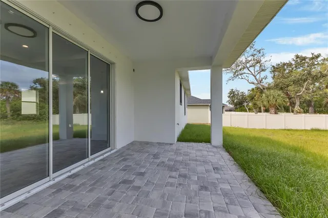 a view of a garden with a building in the background