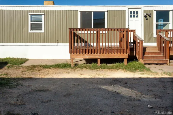 a view of a deck with a yard