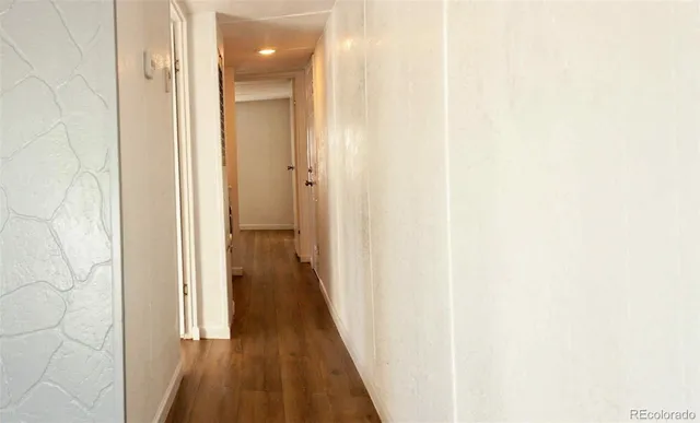 a view of a bathroom from the hallway