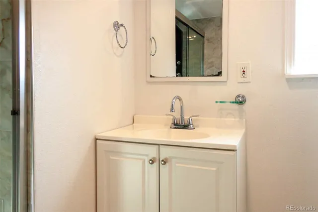a bathroom with a sink and mirror