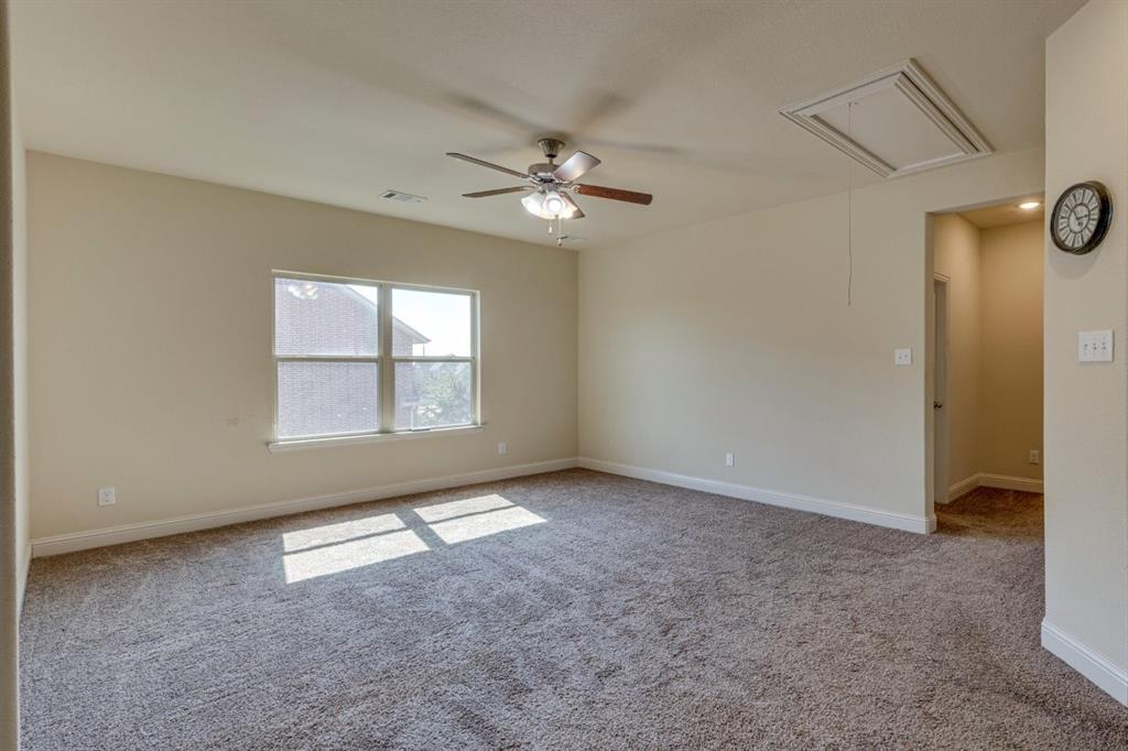 336 Red Hill Road Sunnyvale, TX 75182 - Photo 24 of 36 an empty room with windows and fan