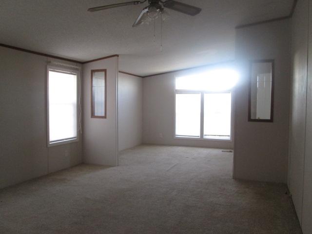 837 Summitt Ridge Drive Blue Ridge, VA 24064 - Photo 11 of 29 an empty room with windows and fan