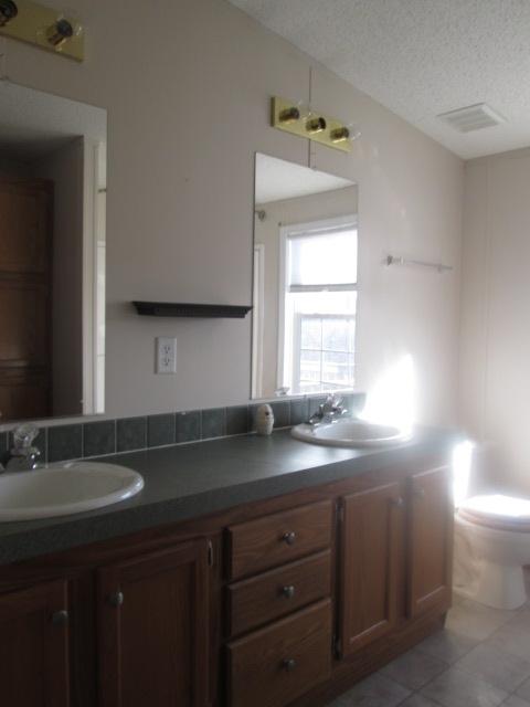 837 Summitt Ridge Drive Blue Ridge, VA 24064 - Photo 18 of 29 a kitchen with a sink cabinets and a window