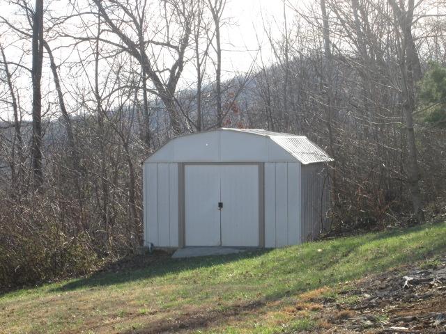 837 Summitt Ridge Drive Blue Ridge, VA 24064 - Photo 26 of 29 a backyard of a house with lots of green space
