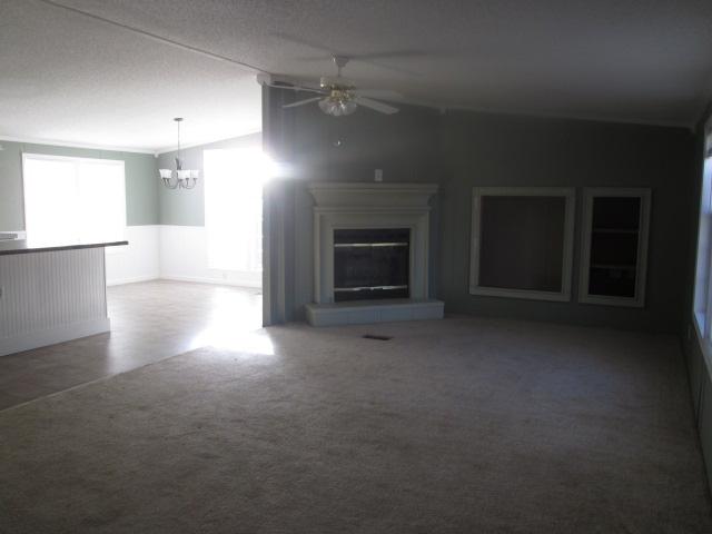 837 Summitt Ridge Drive Blue Ridge, VA 24064 - Photo 5 of 29 an empty room with windows and fireplace